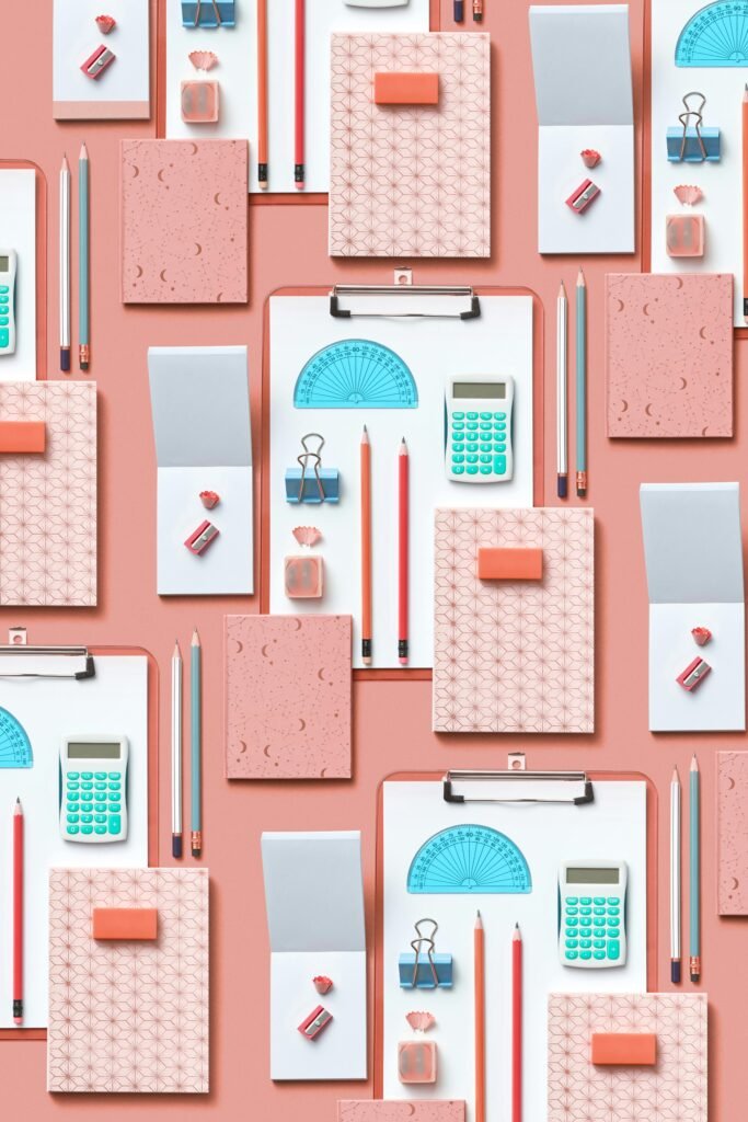 pexels photo 8099590 8099590 Colorful assortment of stationery items arranged on a pink background in a flat lay style.